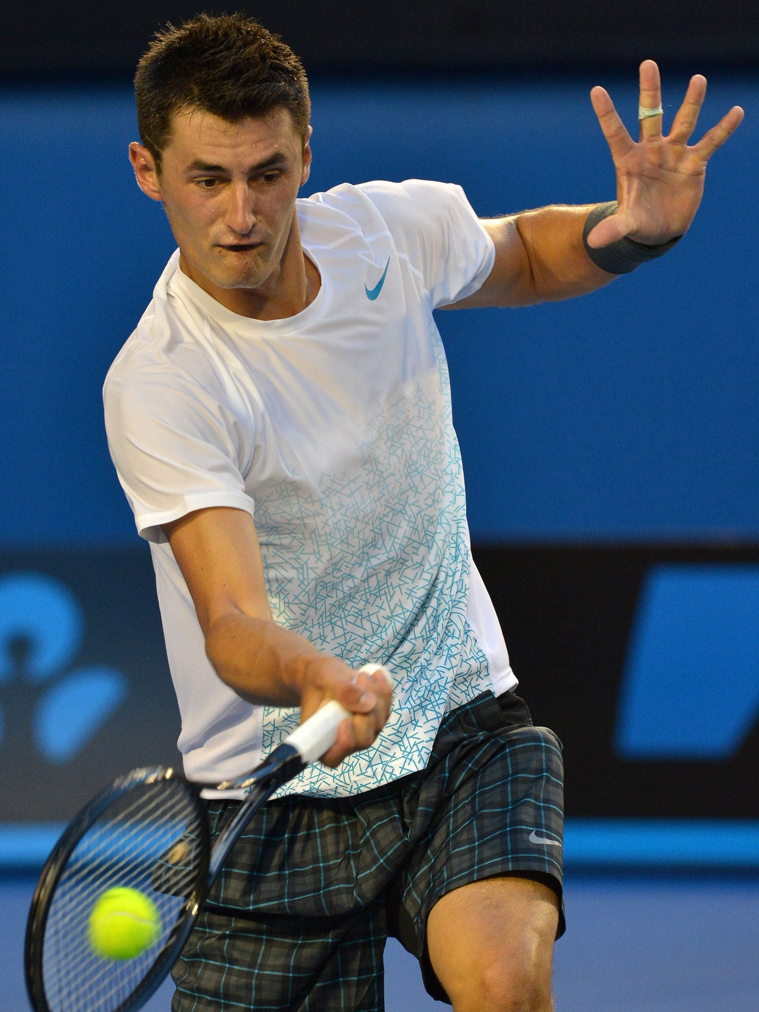 Moment of strewth: Bernard Tomic, the only remaining home player in the Australian Open singles, was beaten in straight sets by Roger Federer