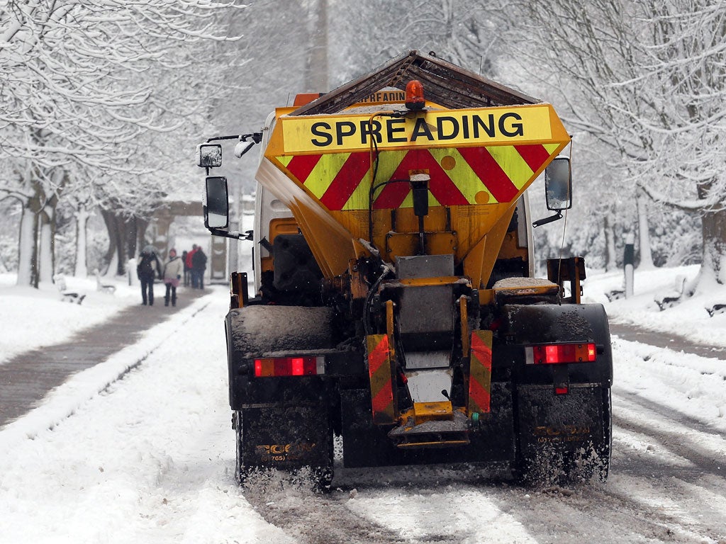 A council gritter spreads grit on roads