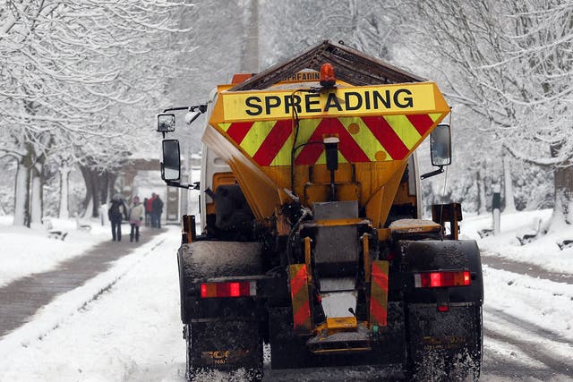 A council gritter spreads grit on roads