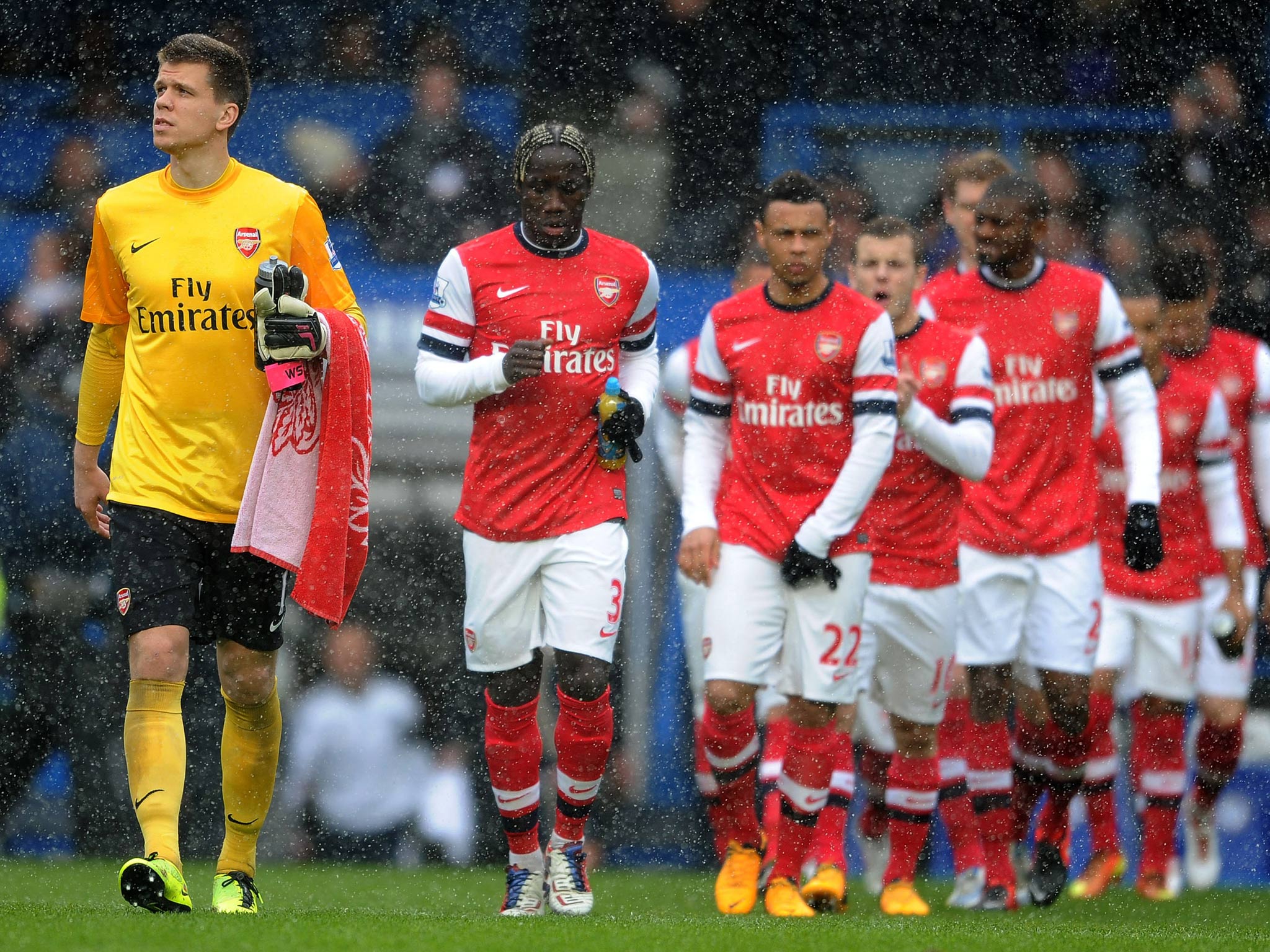 Arsenal walk out onto the pitch against Chelsea