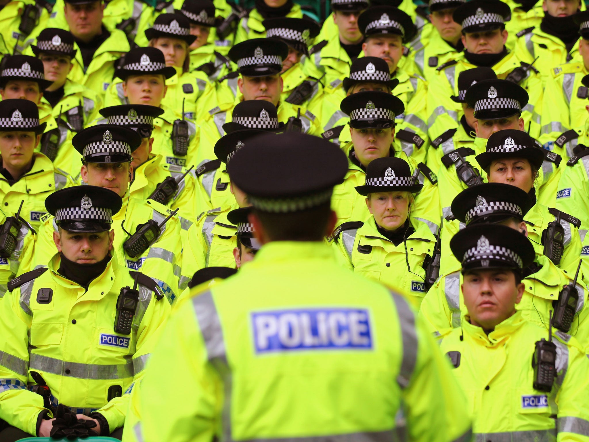 Police are briefed prior to the Clydesdale Bank Premier League match between Celtic and Rangers at Celtic Park on February 20, 2011 in Glasgow, Scotland.