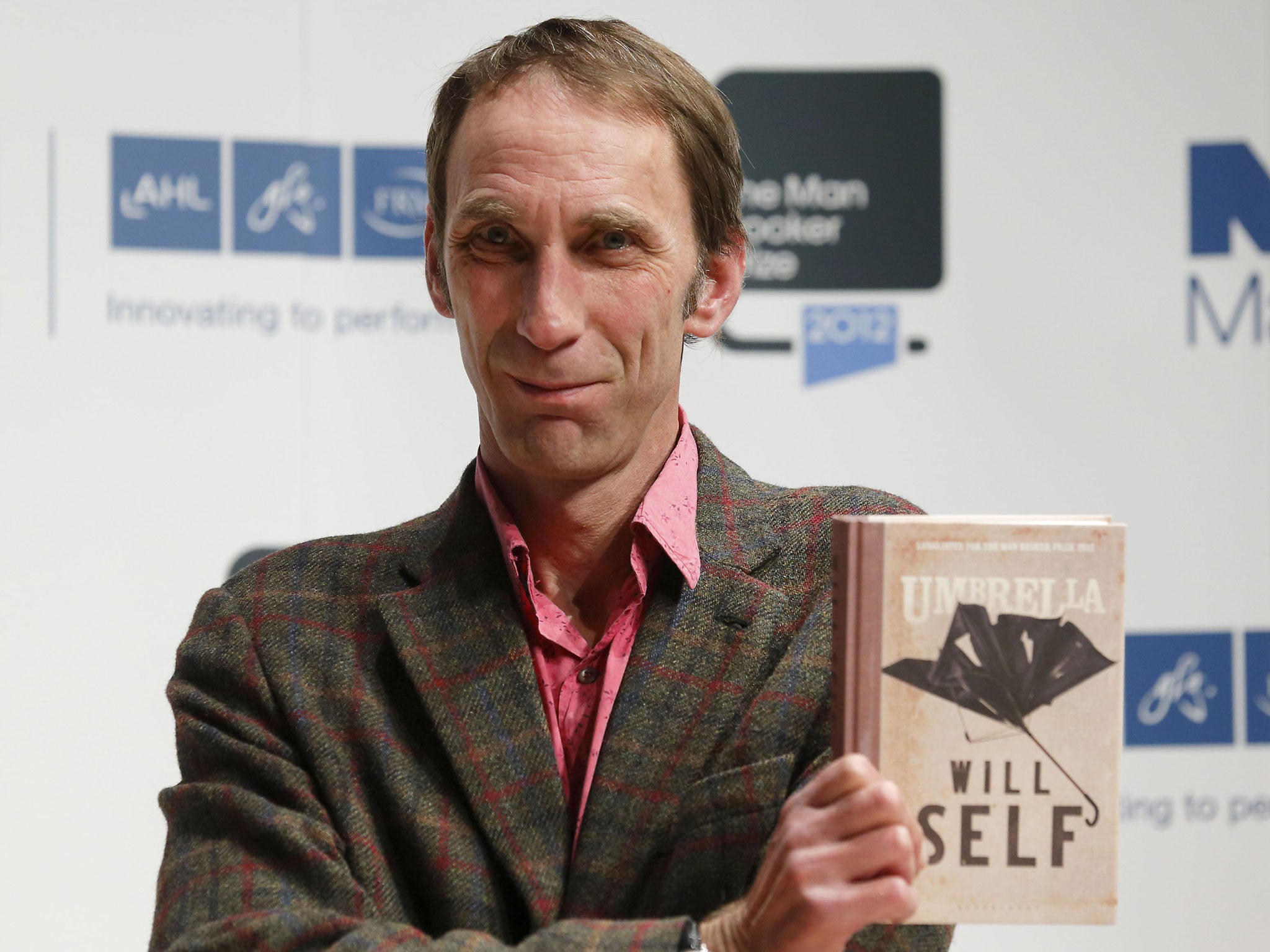 Will Self holding his book 'Umbrella' for which he is shortlisted for the Man Booker 2012 literary prize poses during a photocall in London on October 15, 2012.