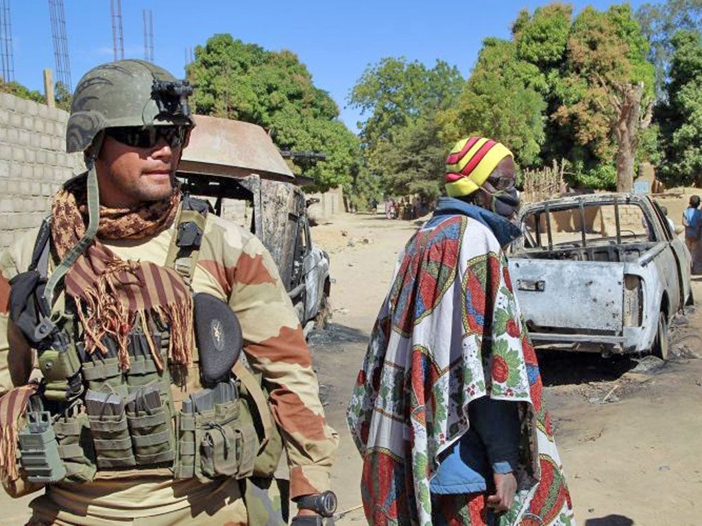 A French soldier secures a perimeter on the outskirt of Diabaly,  Mali, some  460kms (320 miles) north of the capital Bamako