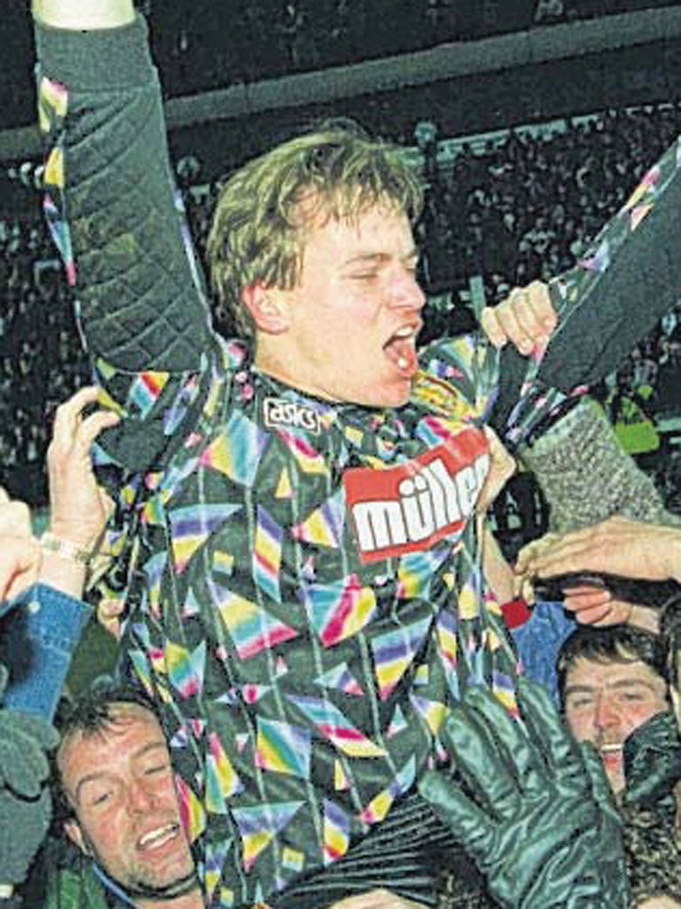 Mark Bosnich celebrates after his shoot-out heroics in 1994