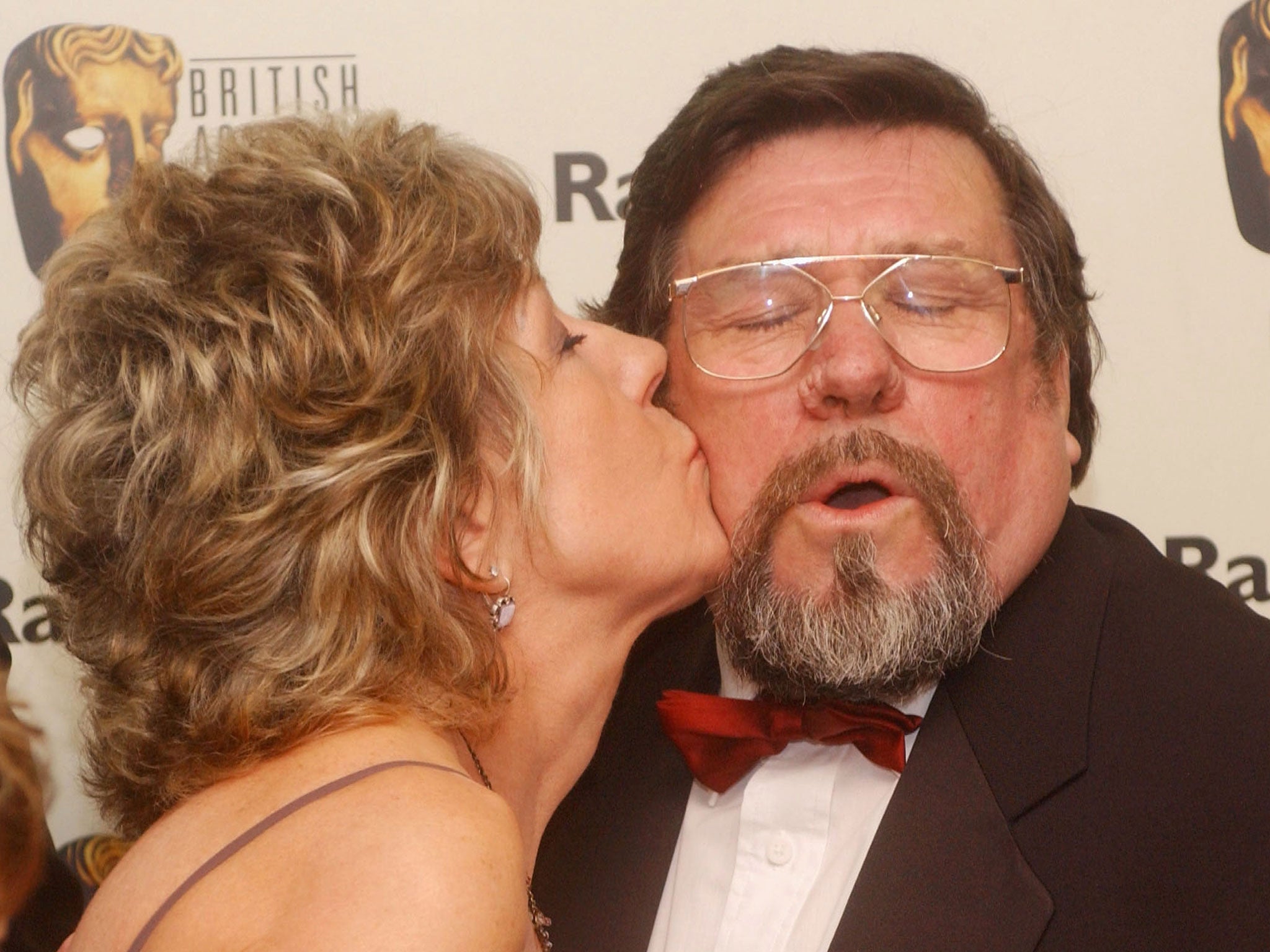 Actress Sue Nicholls kisses actor Ricky Tomlinson after winning the award for Best Continuing Drama in the pressroom following the 'The British Academy Television Awards' at the Grosvenor House Hotel on April 18, 2004 in London.