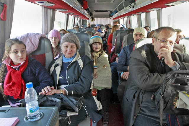 Russian citizens on board a bus shortly after crossing the border from Syria into Lebanon