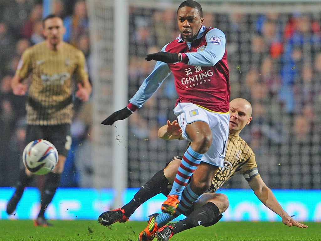 Gary Jones of Bradford City tackles Villa's Charles N'Zogbia