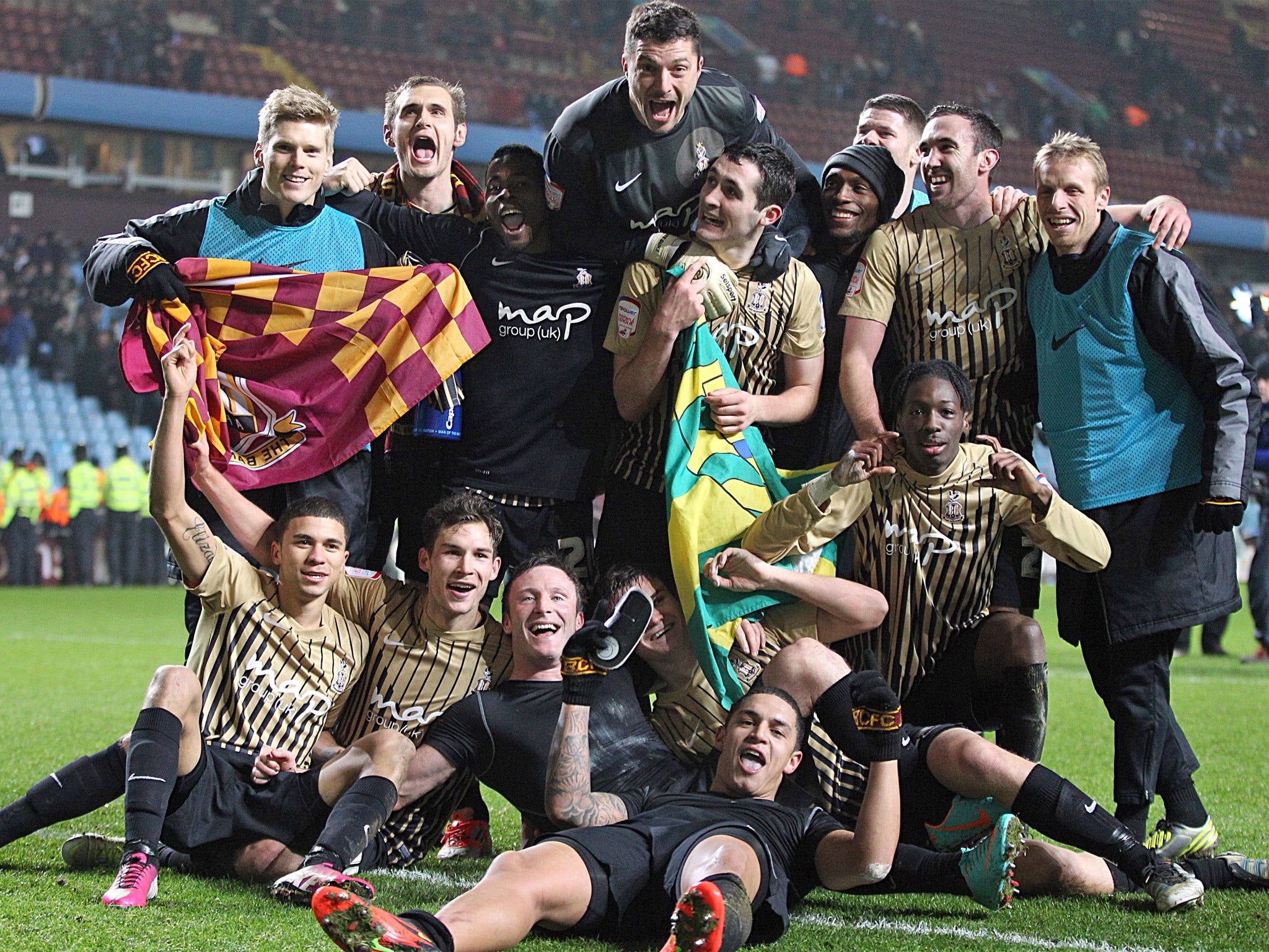 Jubilant Bradford players celebrate reaching Wembley last night