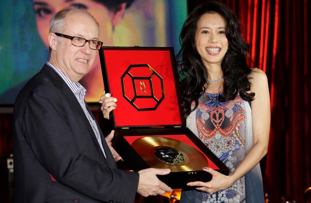 Max Hole, pictured with singer Karen Mok, has called on the Classical music industry to shed its stuffy and elitist image