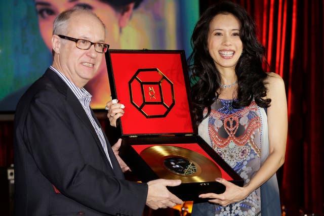 Max Hole, pictured with singer Karen Mok, has called on the Classical music industry to shed its stuffy and elitist image