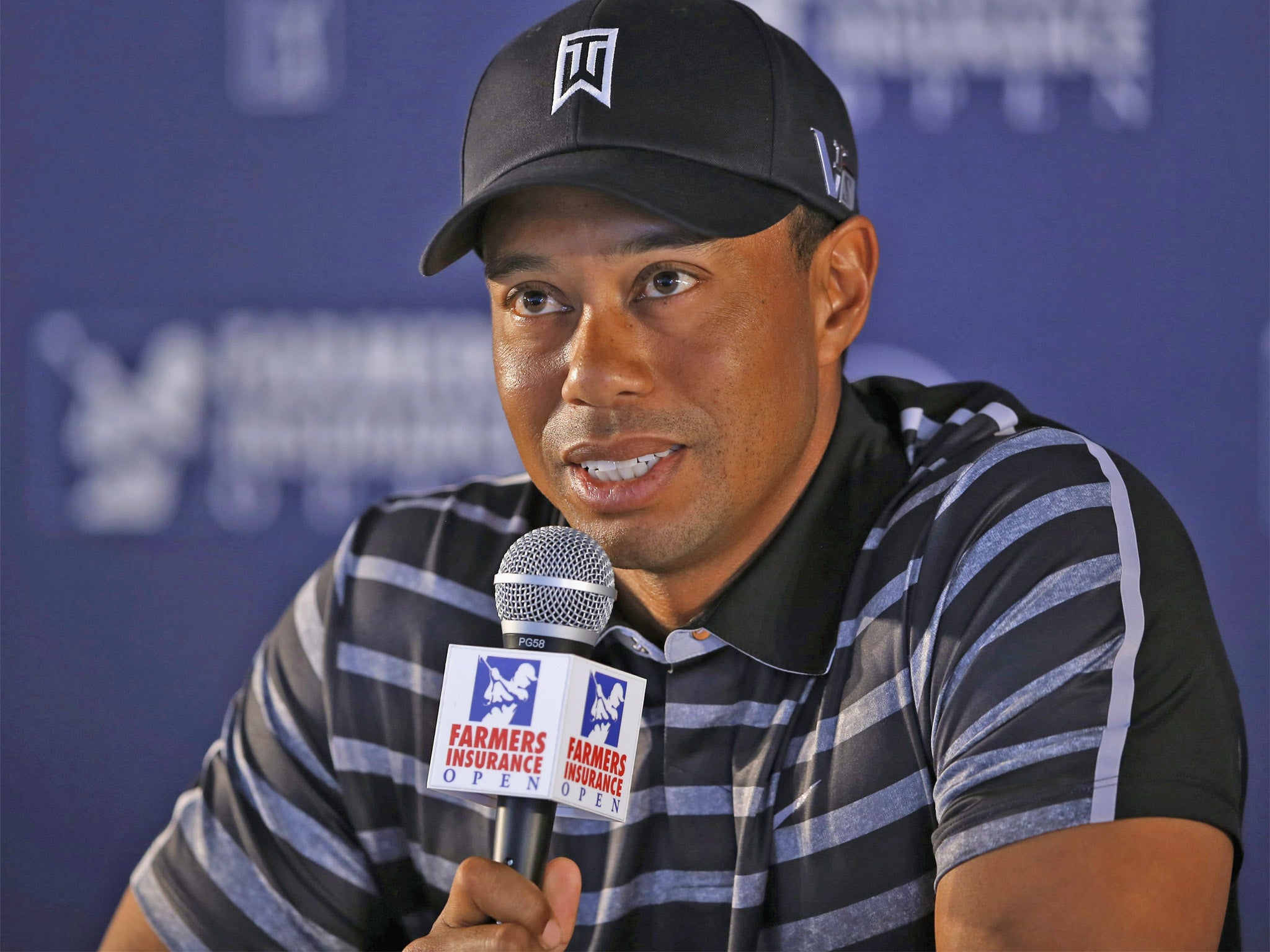 Tiger Woods speaks during a news conference at the Farmers Insurance Open in San Diego