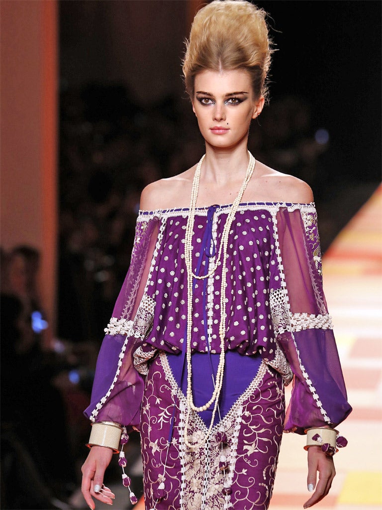 A model presents a creation by French designer Jean Paul Gaultier during the Haute Couture Spring-Summer 2013 collection show