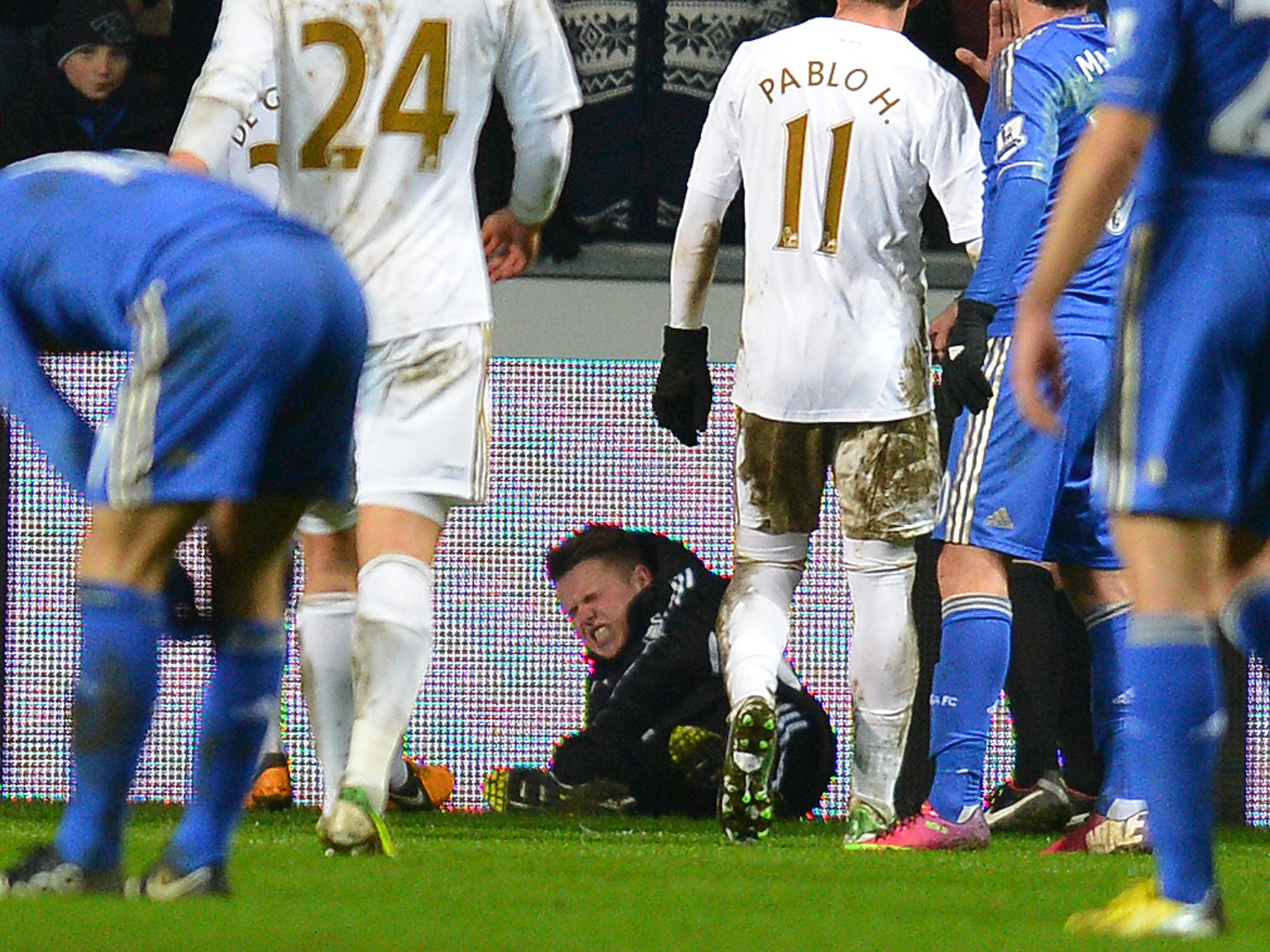 The ball boy in pain after getting kicked by Eden Hazard