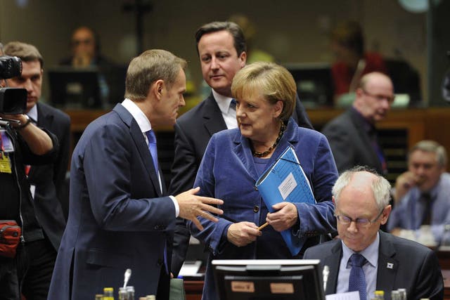 Outsider: Angela Merkel, Polish PM Donald Tusk - and David Cameron