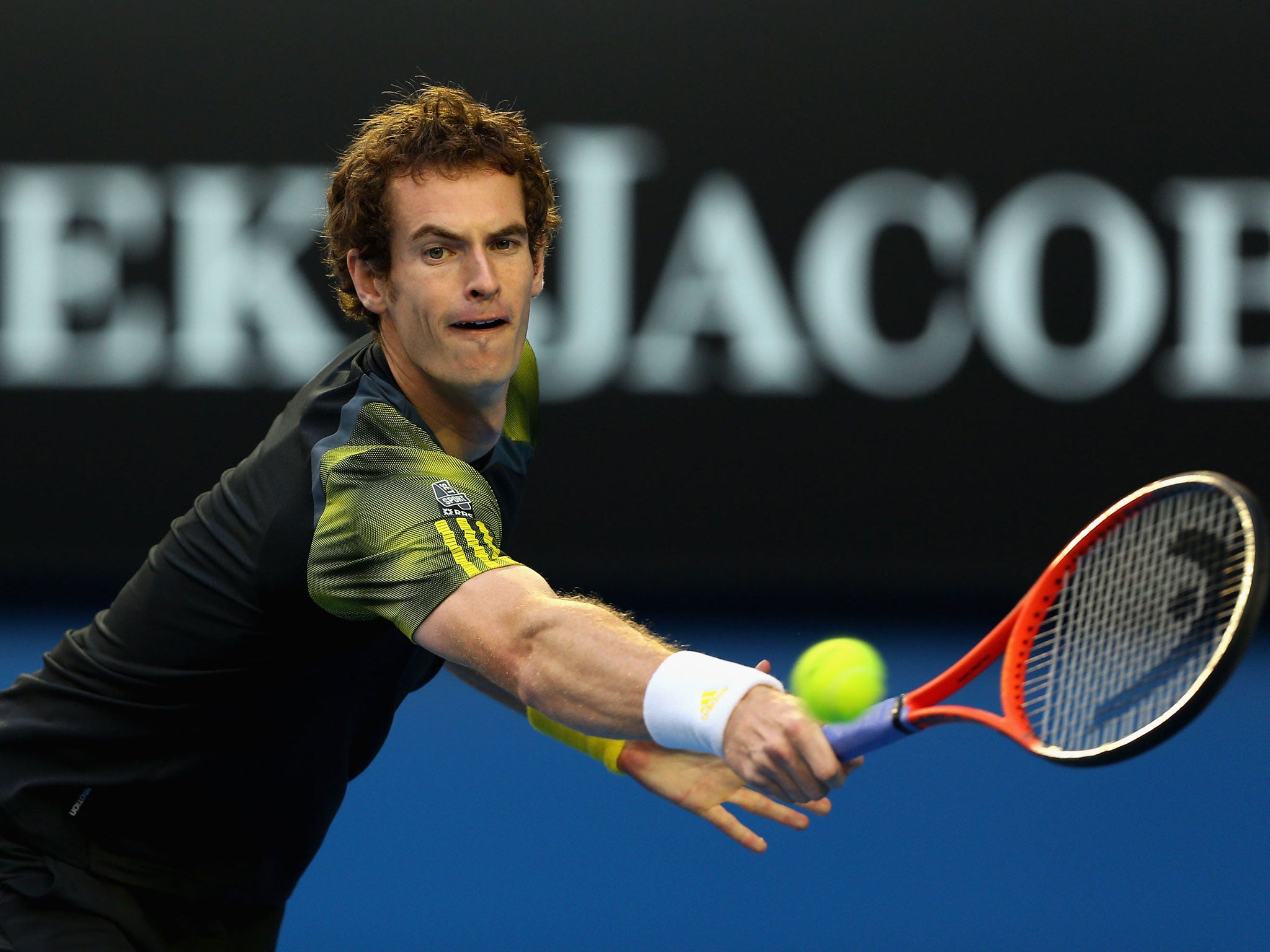 Andy Murray of Great Britain plays a backhand in his semifinal match against Roger Federer
