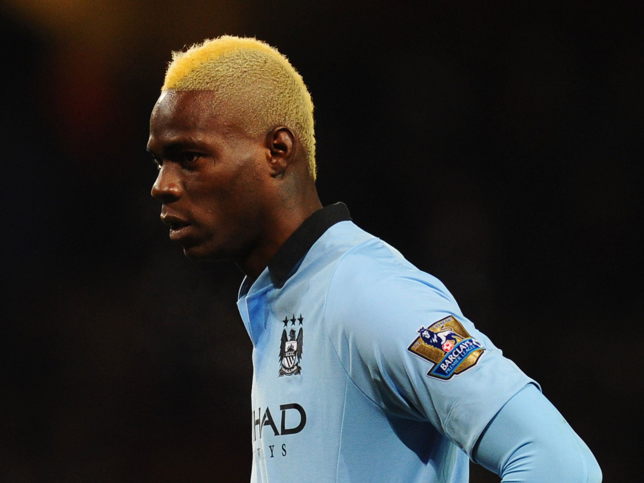 Mario Balotelli of Manchester City looks on during the Barclays Premier League match between Arsenal and Manchester City