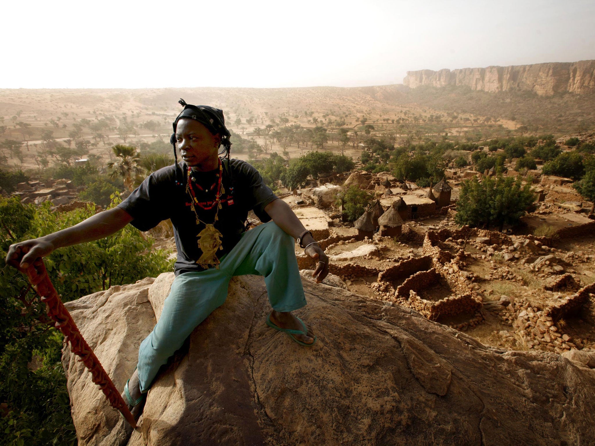 A member of the Dogon tribe above the Malian village of Nomburi