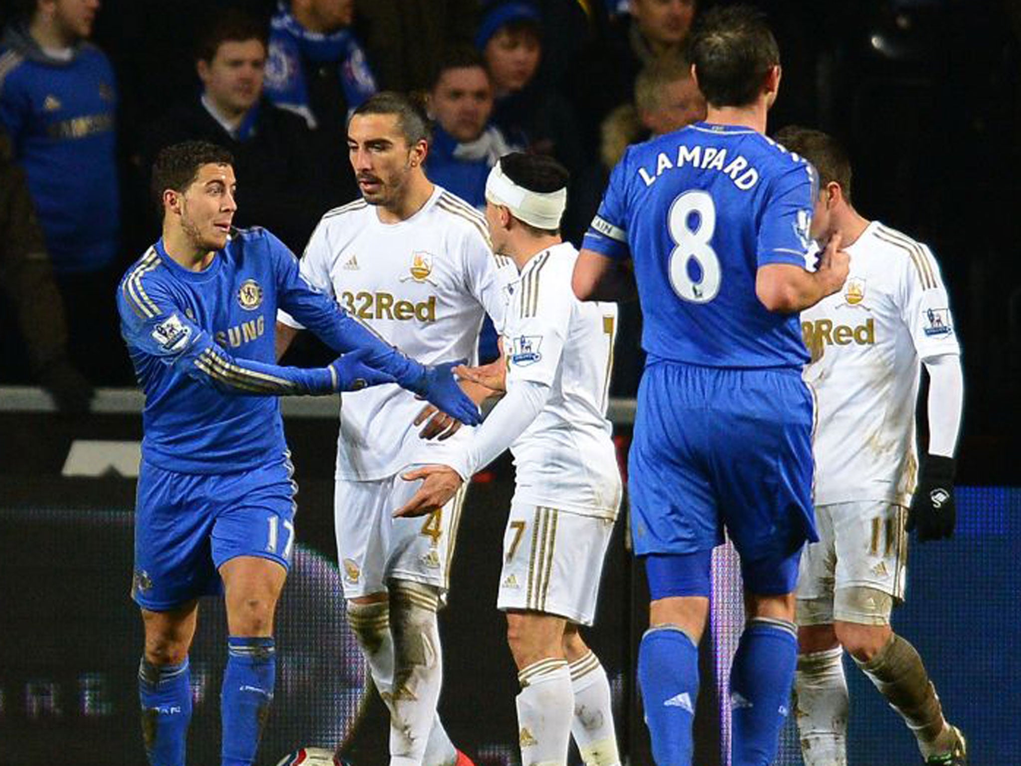 Swansea players remonstrate with Eden Hazard after the incident