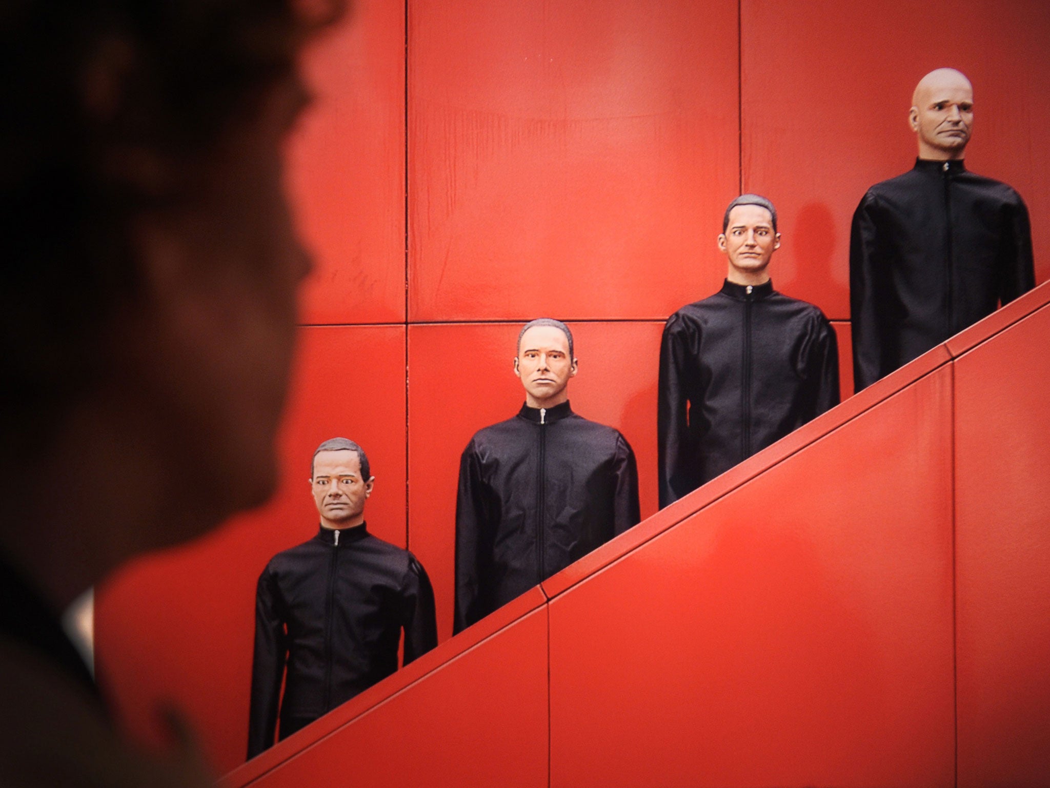 Gang of four: Kraftwerk are as likely to field robots as appear in person