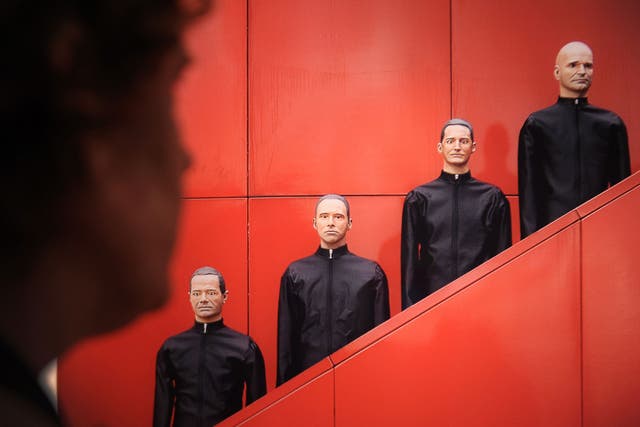 Gang of four: Kraftwerk are as likely to field robots as appear in person