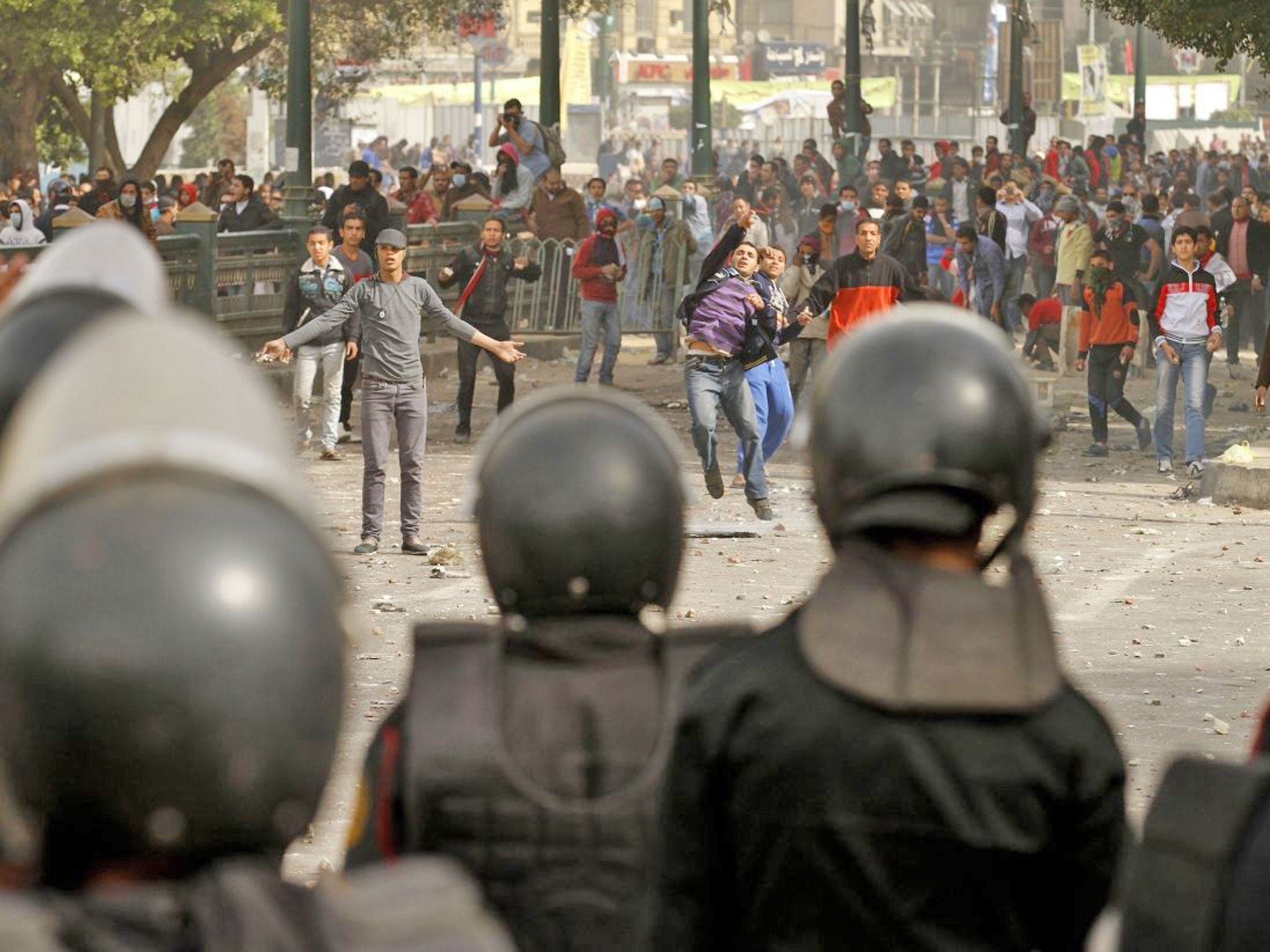 Protesters throw stones at riot policemen in Port Said