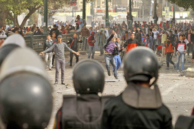 Protesters throw stones at riot policemen in Port Said