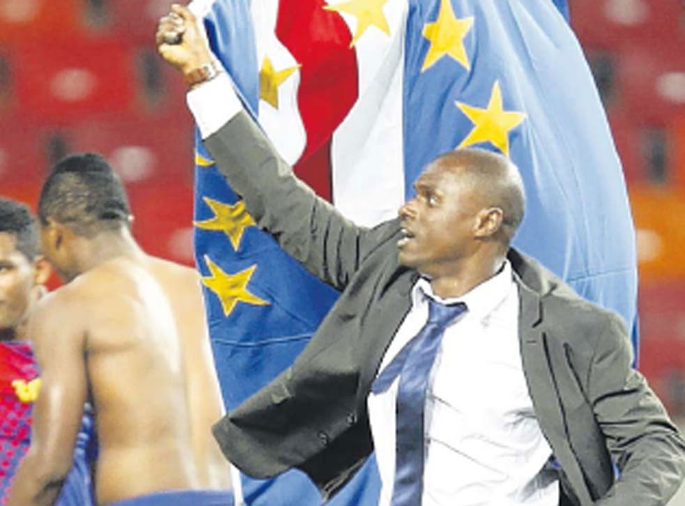 Cape Verde coach Lucio Antunes carries his country’s flag