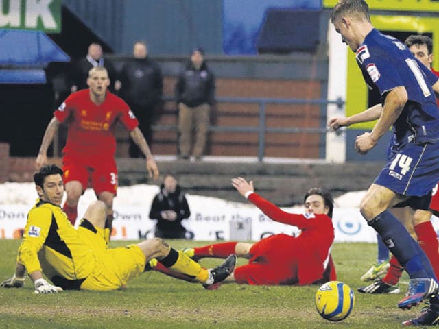 Oldham striker Matt Smith scores his side’s second goal at
Boundary Park yesterday