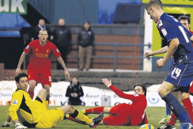 Oldham striker Matt Smith scores his side’s second goal at
Boundary Park yesterday