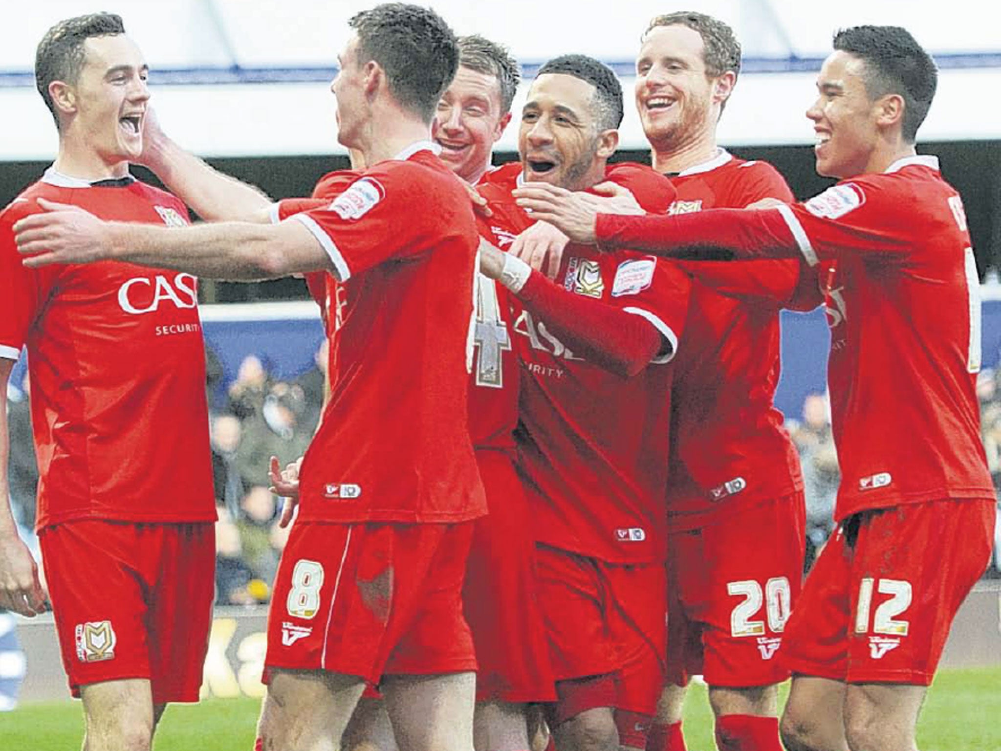 MK Dons’ Darren Potter celebrates with his team-mates