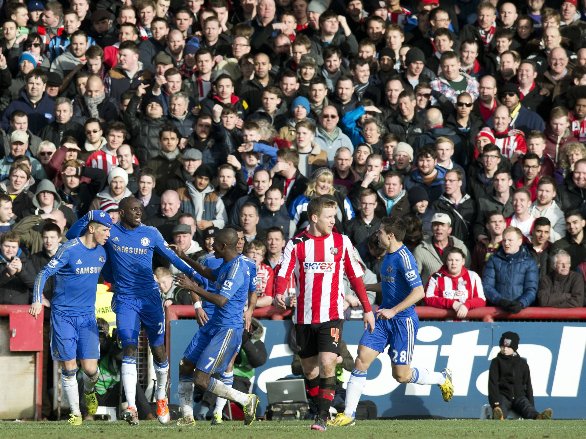 Chelsea striker Fernando Torres is congratulated for scoring in the 2-2 draw with Brentford