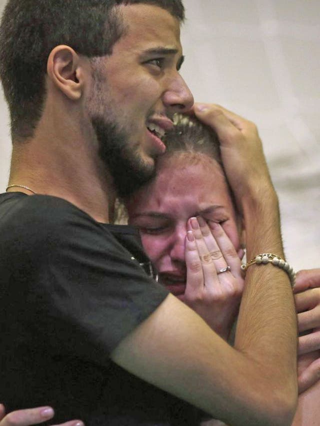 Relatives of victims of the fire at Boate Kiss nightclub attend a collective wake in the southern city of Santa Maria,