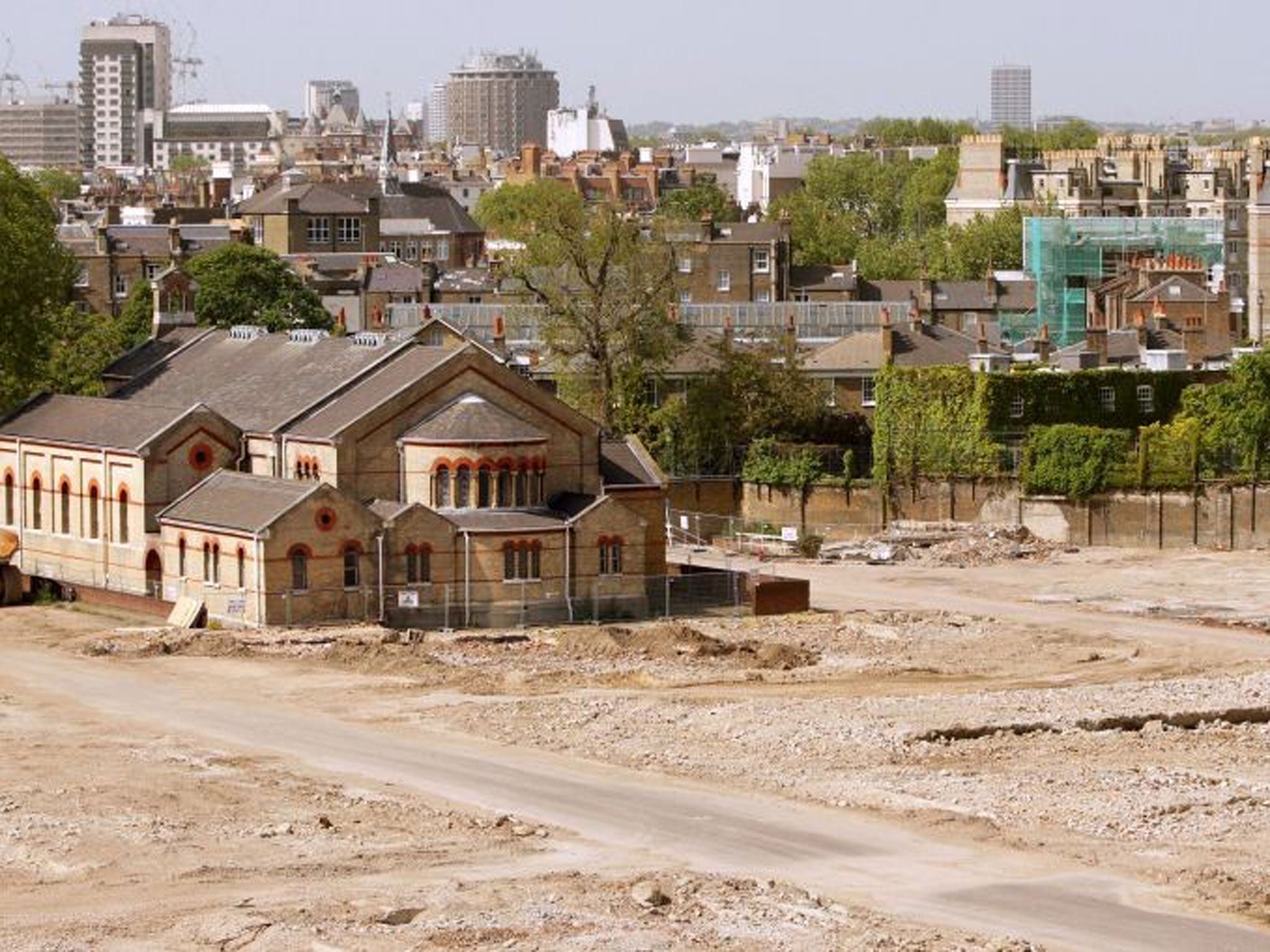 The 19th Century Garrison Church is surrounded by wasteland on the site of the former Chelsea Barracks which is being redeveloped into a glass-and-steel design by architect Richard Rogers in 2009