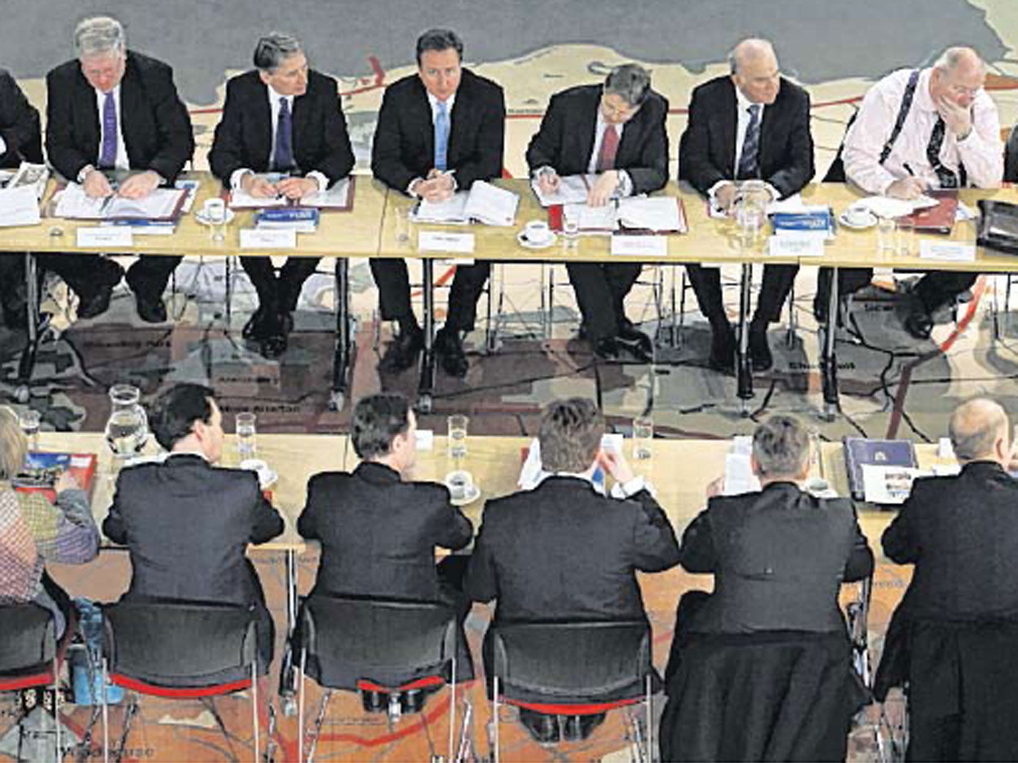 David Cameron (top centre) at a cabinet meeting in Leeds today. The PM sayts he is detemined to push ahead with HS2