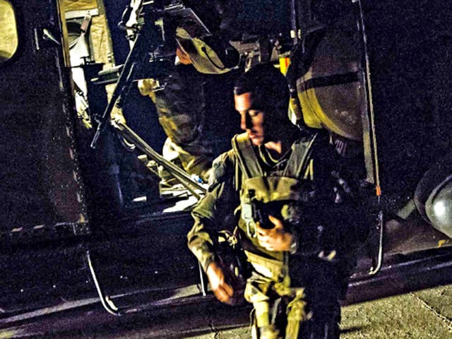 French soldiers flying back from Timbuktu, arrive at the French army base in Sevare, Mali, last night