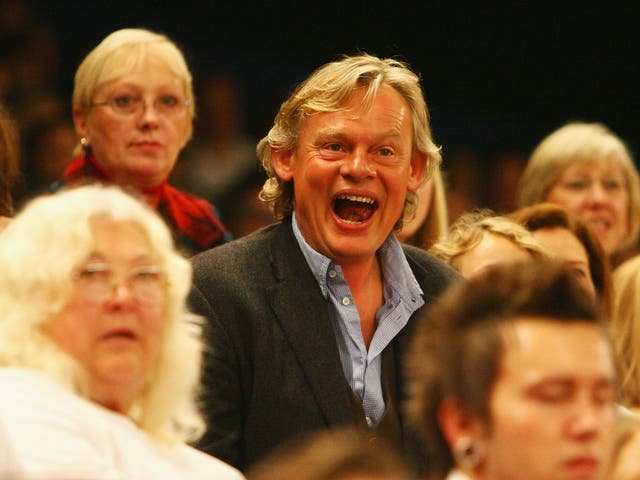 Television actor Martin Clunes watches from the stands during the fourth day of the Horse of the Year Show at the NEC on October 11, 2008 in Birmingham, England.