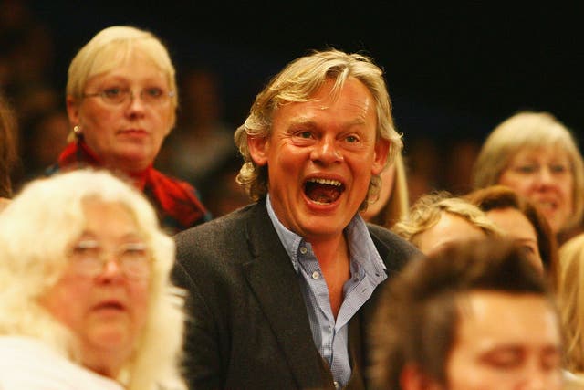 Television actor Martin Clunes watches from the stands during the fourth day of the Horse of the Year Show at the NEC on October 11, 2008 in Birmingham, England.