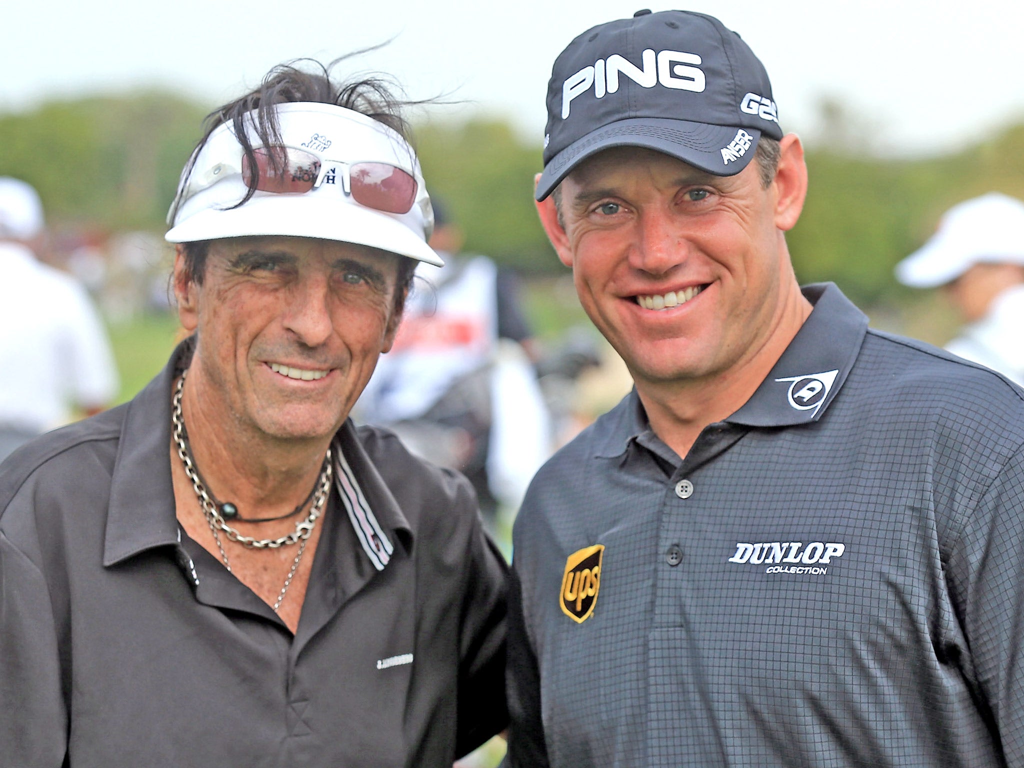 World No 8 Lee Westwood with rock star Alice Cooper (left) during a challenge match in Dubai yesterday
