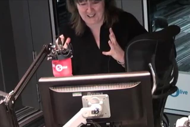 BBC 5Live presenter Shelagh Fogarty gets flustered after a mouse in spotted in the studio