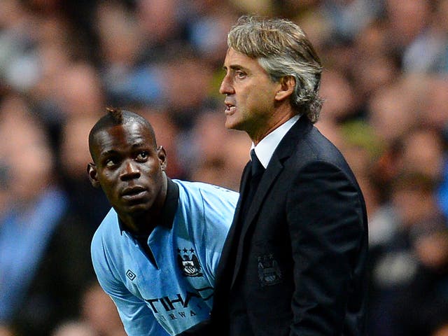 Mario Balotelli with Roberto Mancini