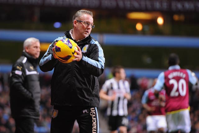 Paul Lambert watches his Aston Villa side lose 2-1 to Newcastle