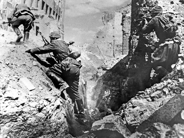 Soviet troops climb out of a trench during the Battle of Stalingrad