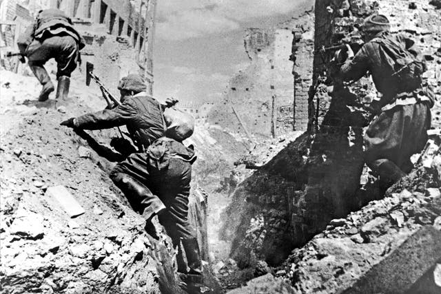 Soviet troops climb out of a trench during the Battle of Stalingrad