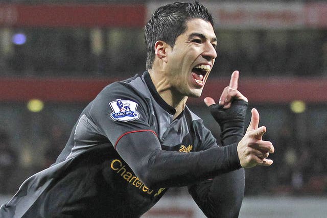 Luis Suarez celebrates scoring Liverpool's first goal