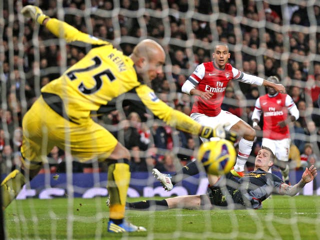 Theo Walcott strikes a fierce shot into the bottom corner to equalise for the Gunners
