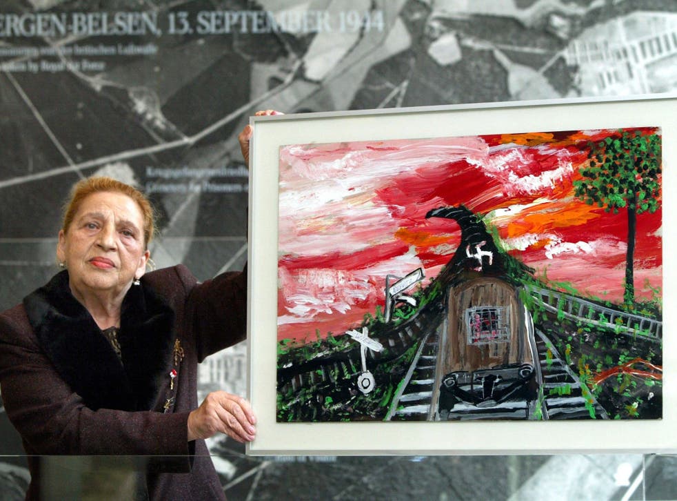 Stojka in 2003 with one of her paintings, ‘Vienna-Auschwitz’ 