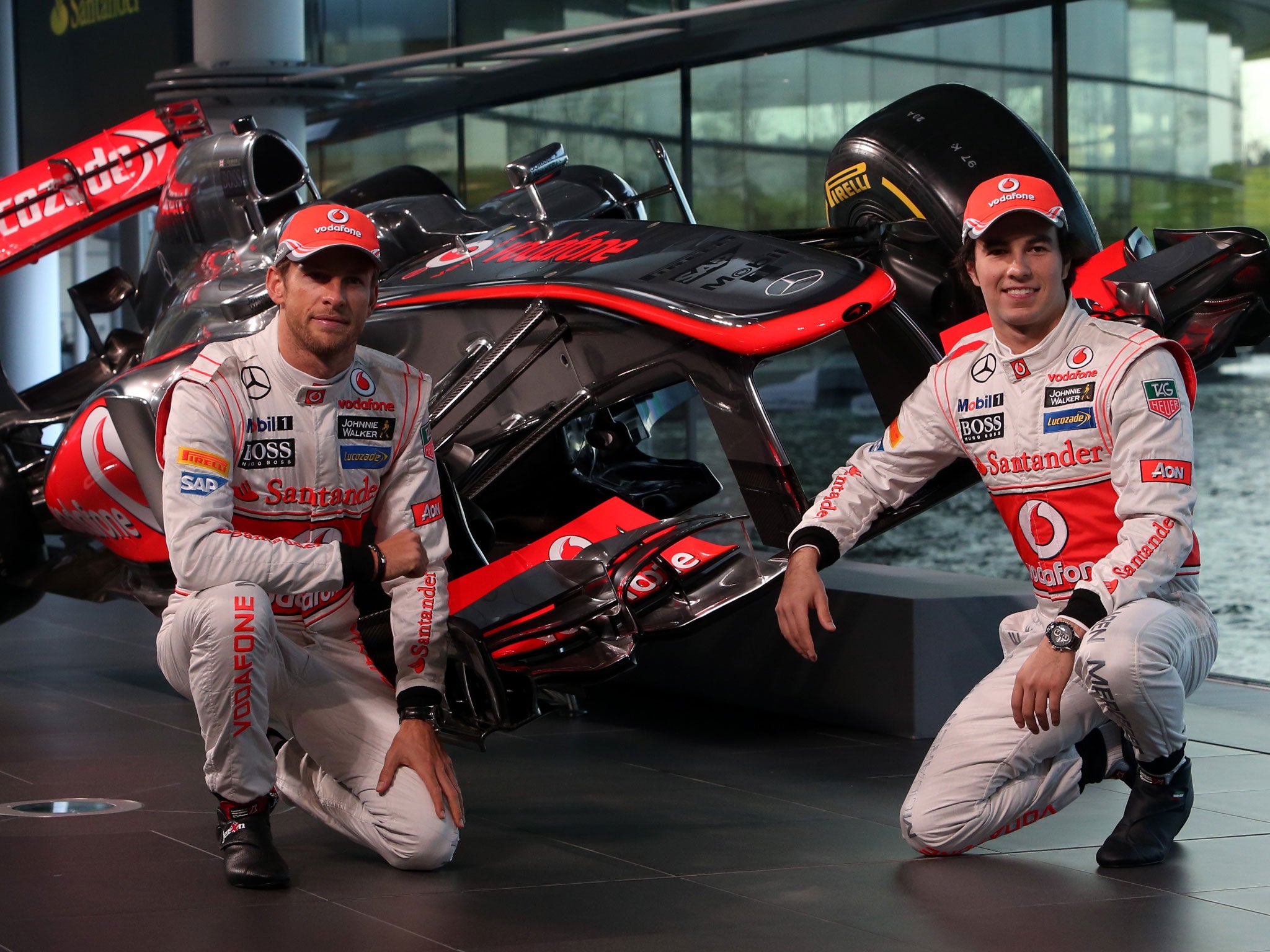Jenson Button (left) and Sergio Perez at the McLaren Mercedes MP4-28 launch in Woking yesterday