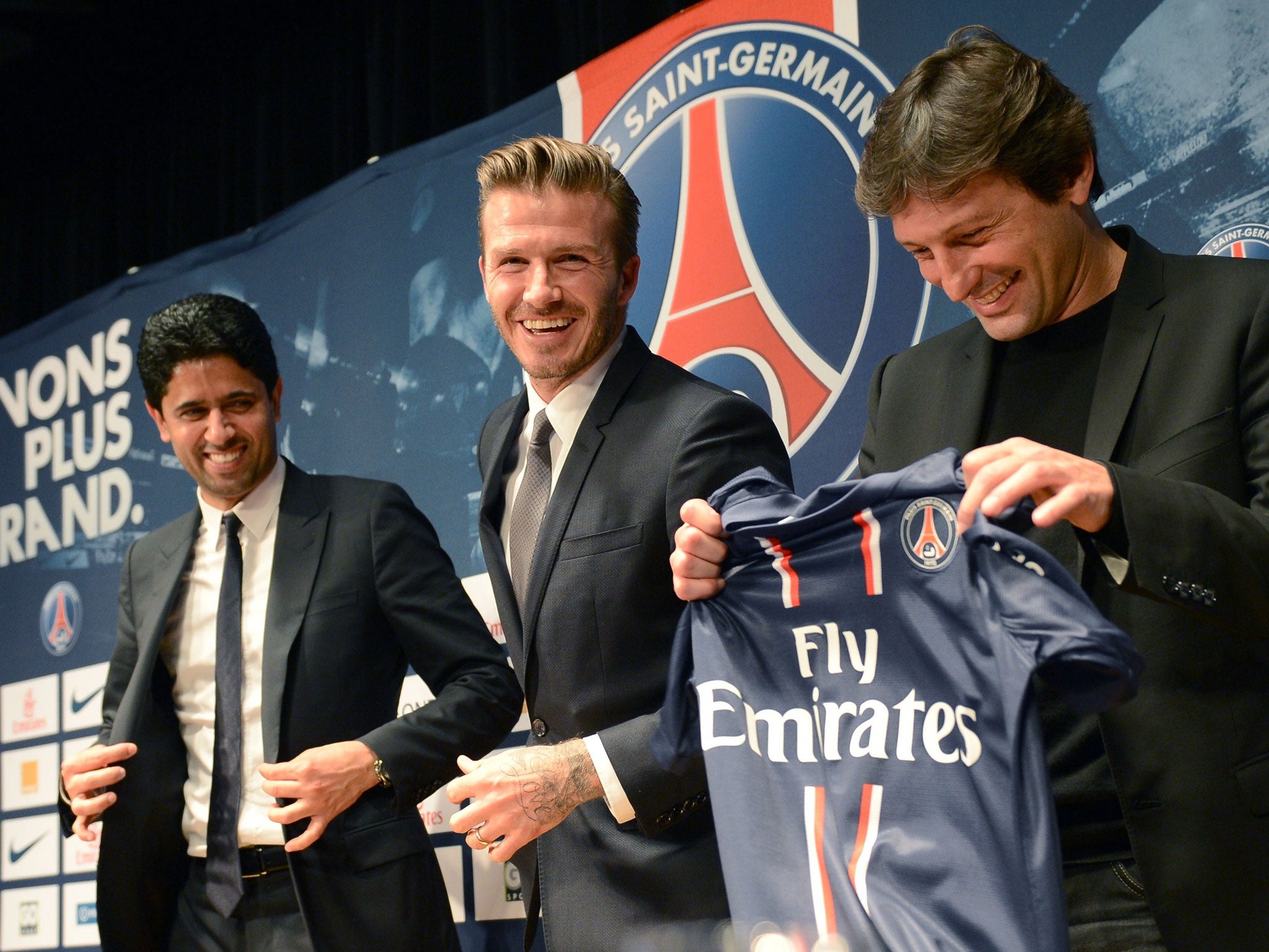 David Beckham is unveiled as a Paris Saint-Germain player by the club president, Nasser al-Khelaifi, and director of football, Leonardo