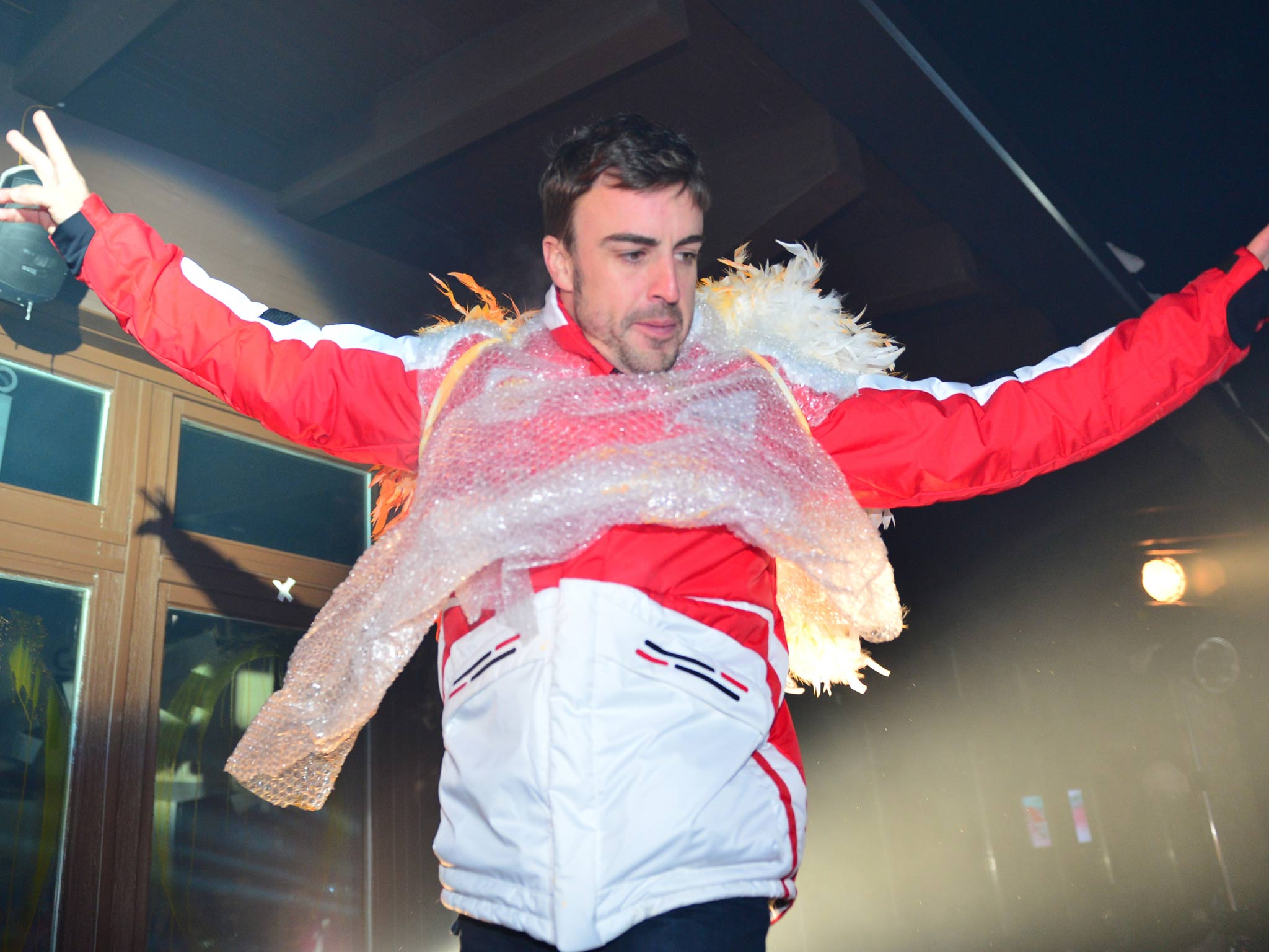 Ferrari driver Fernando Alonso performs on stage during a show at the Wrooom, F1 and MotoGP press ski meeting earlier this month