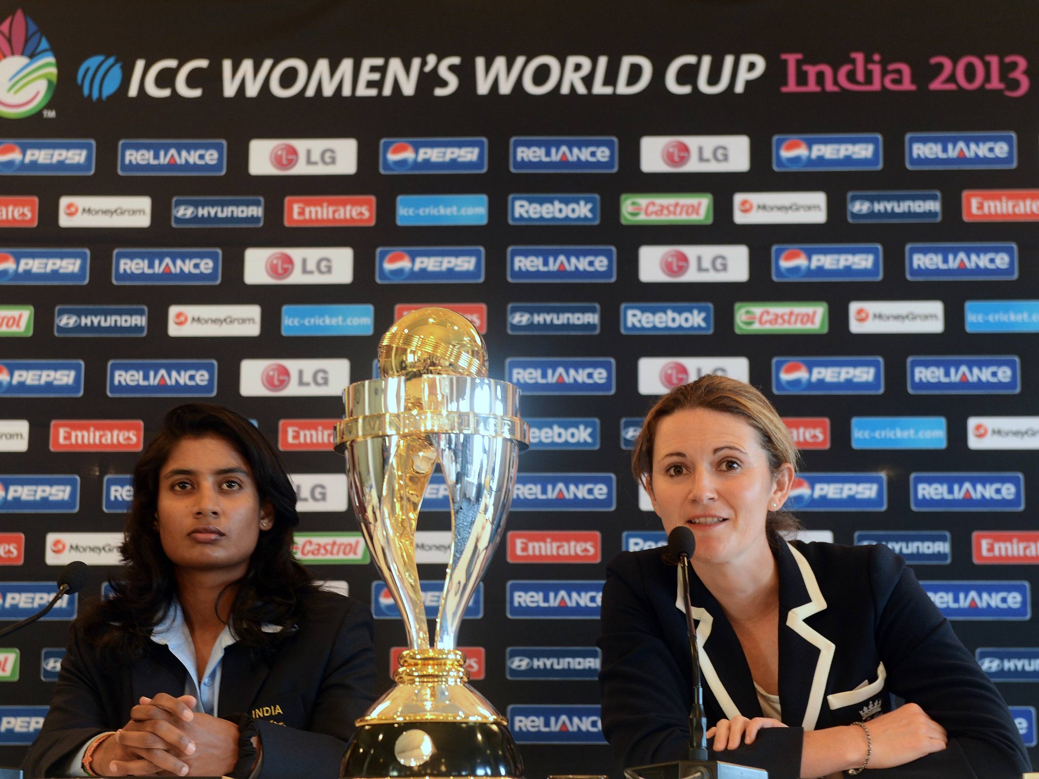 India captain Mithali Raj (L) looks on as England captain Charlotte Edwards speaks ahead of the women's cricket World Cup